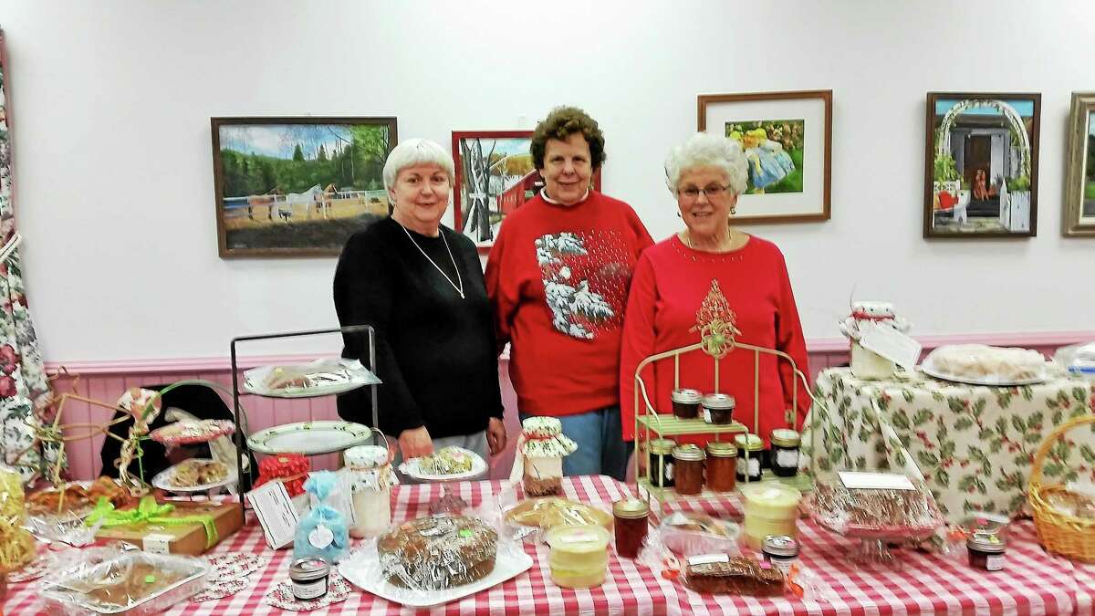 N.F. Ambery/Register Citizen Volunteers Barbara Aseltine of Canton; Anne Dolson of Canton; and Caryl Pucino of Barkhamsted of the Women’s Guild of Immaculate Conception Church in New Hartford, oversee the bake sale table at The Nov. 8 Christmas Fair, held at the Barkhamsted Senior Center at 109 River Road.