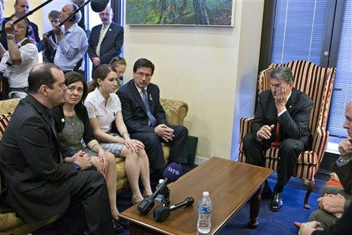 Sen. Joe Manchin, D-W.Va., seated right, meets in his office with families of victims of the Sandy Hook Elementary School shooting in Newtown, Conn., on the day he announced that they have reached reached a bipartisan deal on expanding background checks to more gun buyers, on Capitol Hill in Washington, Wednesday, April 10, 2013. Seated on sofa from left are David and Francine Wheeler, who lost their six-year-old son Ben in the shooting, Katy Sherlach and her father Bill Sherlach, whose wife Mary Sherlach was killed. At far right is Mark Barden, father of victim Daniel Barden. (AP Photo/J. Scott Applewhite) (AP Photo/J. Scott Applewhite)