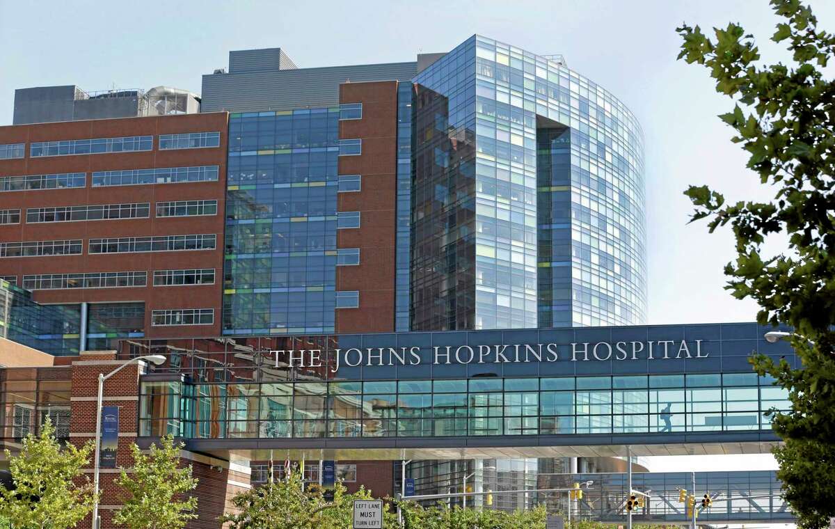 FILE - This Oct. 2, 2013, file photo shows part of the Johns Hopkins Hospital complex in Baltimore. The hospital has reached a tentative labor agreement with a union representing about 2,000 workers at the medical institution. A Hopkins spokeswoman said Tuesday, July 8, 2014, that a union vote will take place over the next couple of days on the tentative agreement. (AP Photo/Patrick Semansky, File)