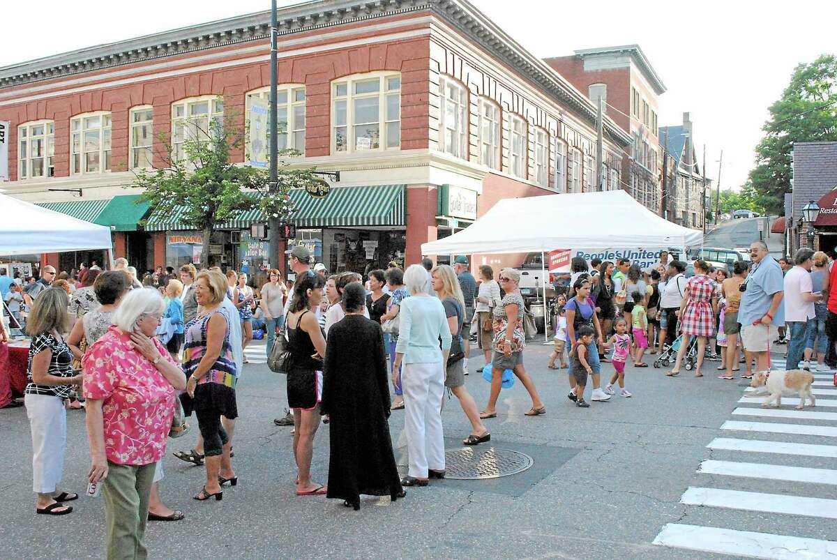 Crowds of people enjoy a night out at Torrington’s Main Street Marketplace, an event which former Economic Development Director Rose Ponte helped create.