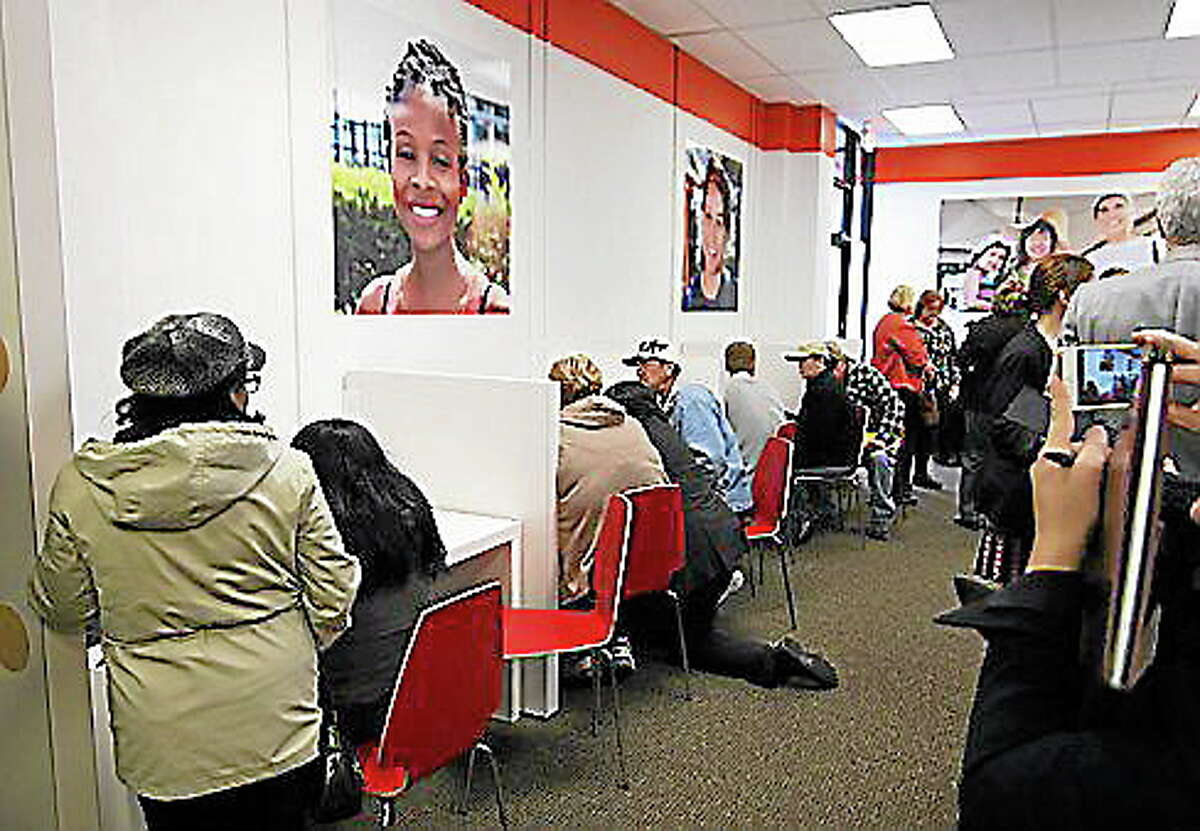 Individuals enroll in health insurance plans at the Access Health CT store in New Britain.