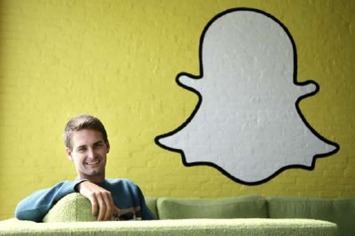 Snapchat CEO Evan Spiegel poses for photos in Los Angeles.
