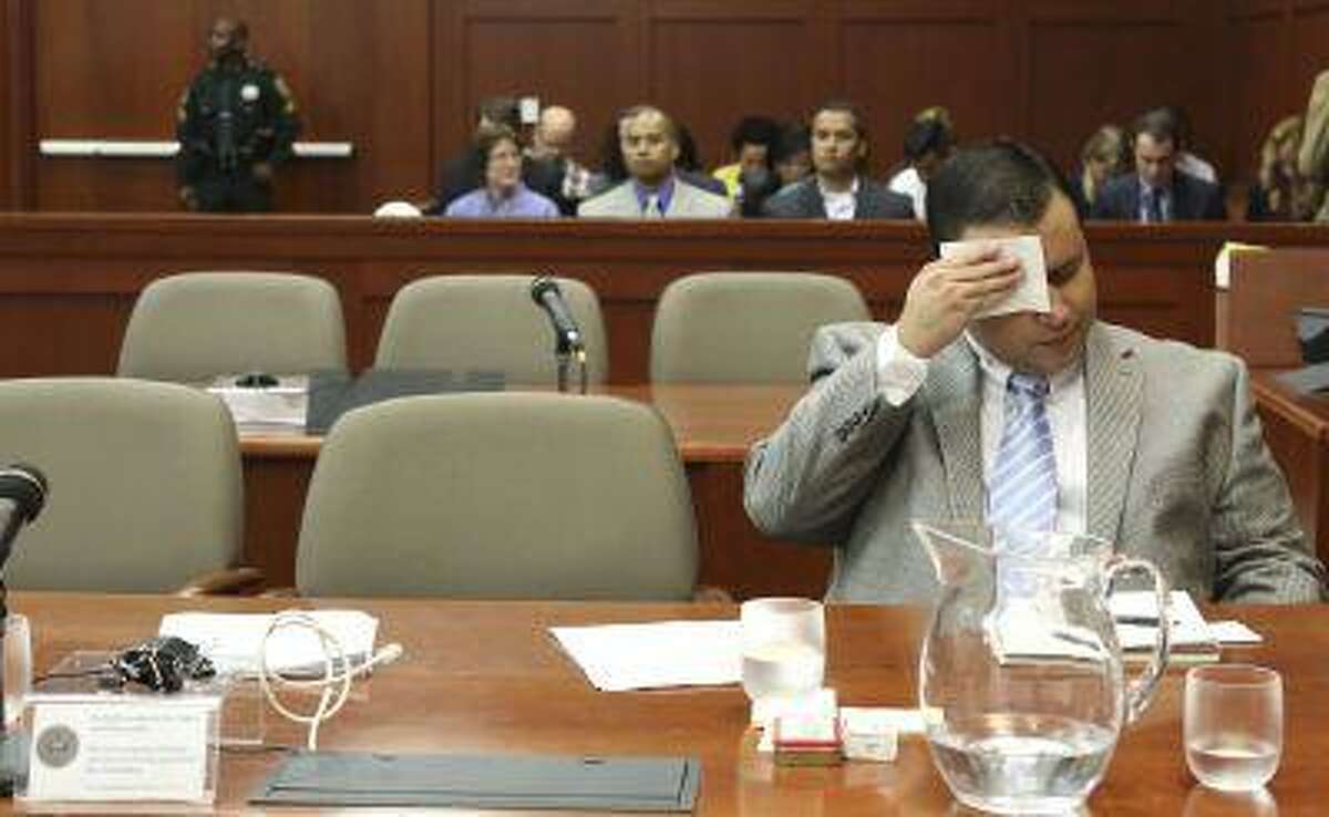 George Zimmerman wipes his brow before the state's closing arguments in Seminole circuit court in Sanford, Florida July 11, 2013.