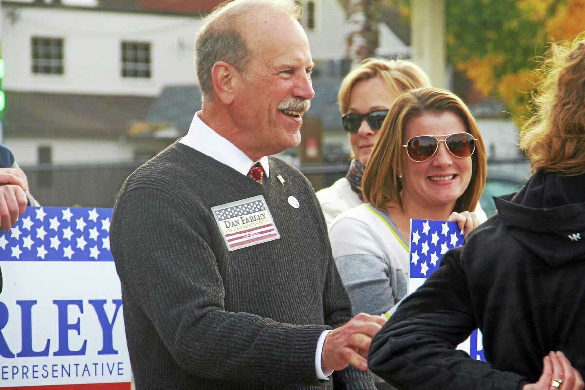 Republican 65th District candidate Dan Farley greets voters at the polls on Election Day Tuesday.