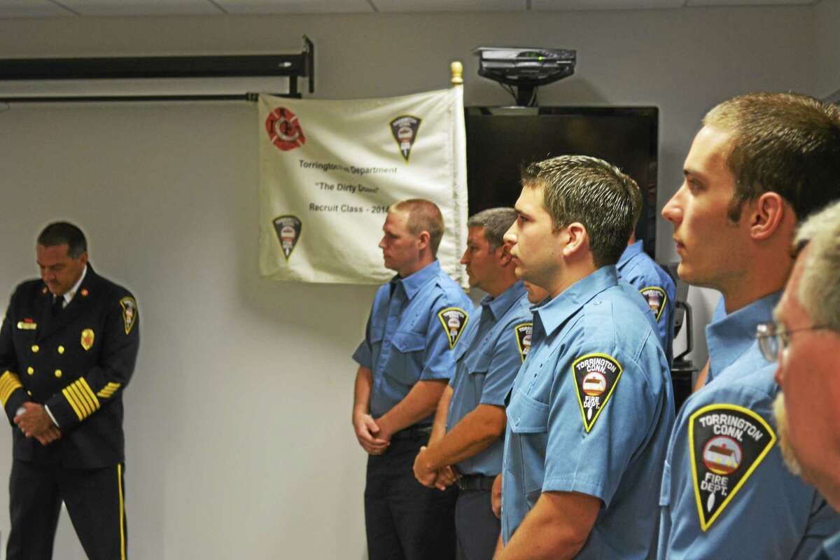The 12 new recruits look on as Deputy Chief of Operations Christopher Pepler speaks.