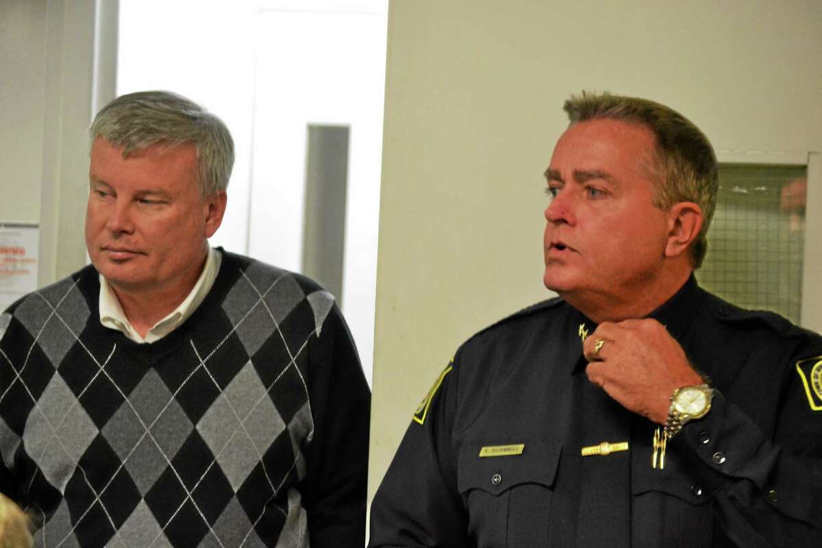 Chief Robert Scannell (right) gave Town Manager Dale Martin (left), members of the Board of Selectmen and others a tour of the police department Monday night.