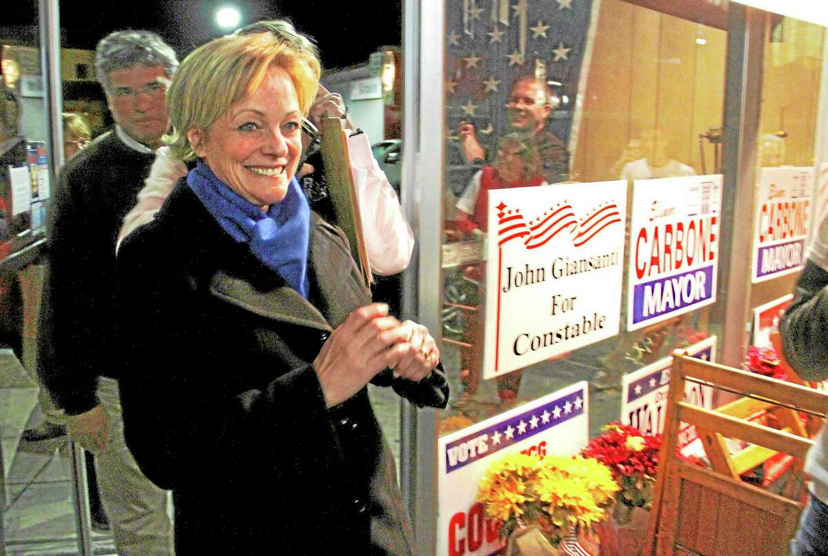 Elinor Carbone, the new Mayor of Torrington, walks into her victory party Tuesday night after results were tallied.Esteban L. Hernandez - Register CItizen