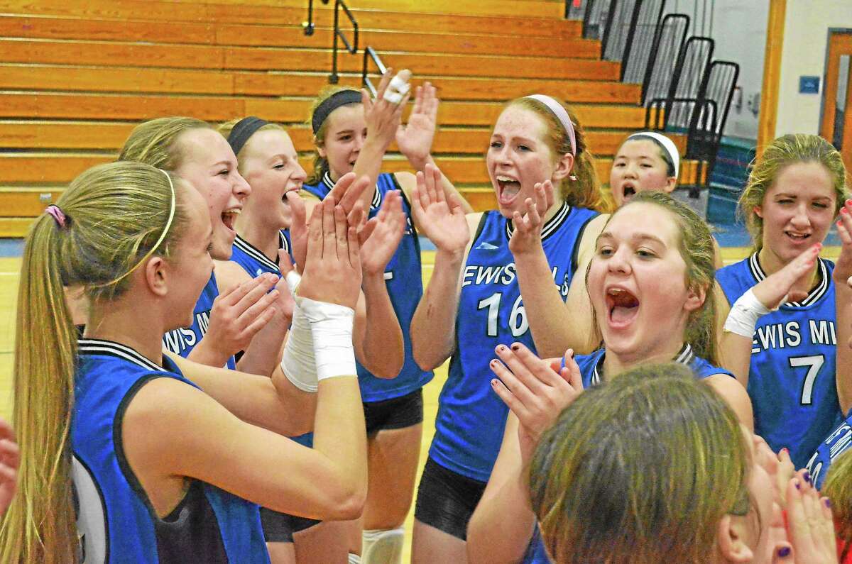 Lewis Mills volleyball team celebrates after winning the Berkshire League championship Friday night after beating Terryville.