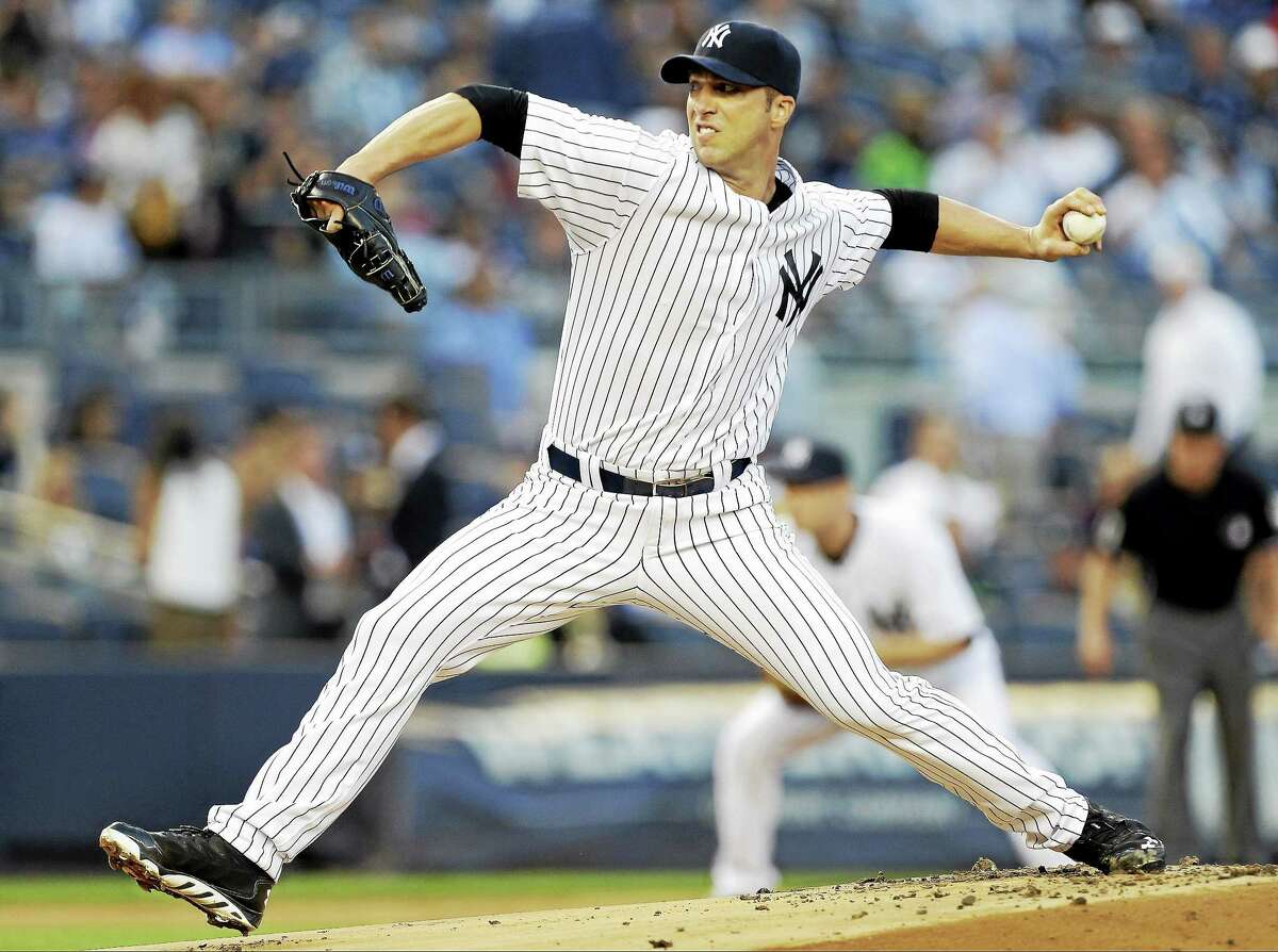 New York Yankees' Chris Capuano delivers a pitch during the first inning of a baseball game against the Houston Astros on Tuesday, Aug. 19, 2014, in New York. (AP Photo/Frank Franklin II)