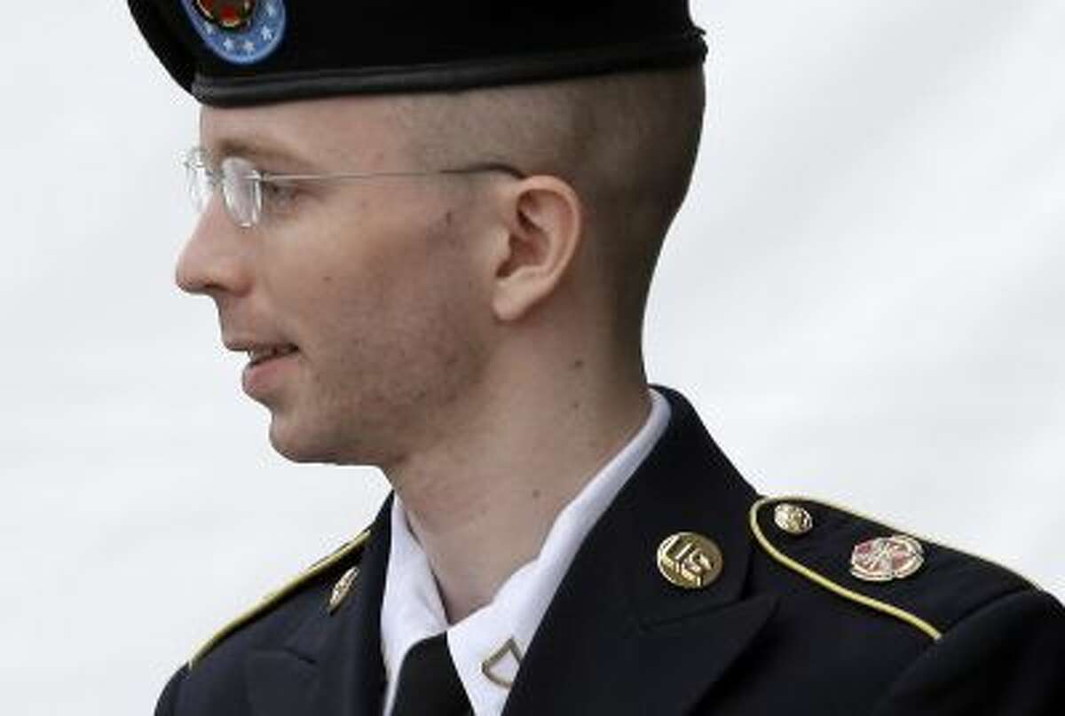 FILE - In this July 30, 2013, file photo, Army Pvt. Chelsea Manning, then-Army Pfc. Bradley Manning, is escorted out of a courthouse in Fort Meade, Md., after receiving a verdict in his court martial. Manning, who was convicted of sending more than 700,000 secret military and State Department documents to the secrets-sharing website WikiLeaks, said in a letter posted by the Private Manning Support Network that she will go to court, if necessary, to be allowed to live as a woman and...