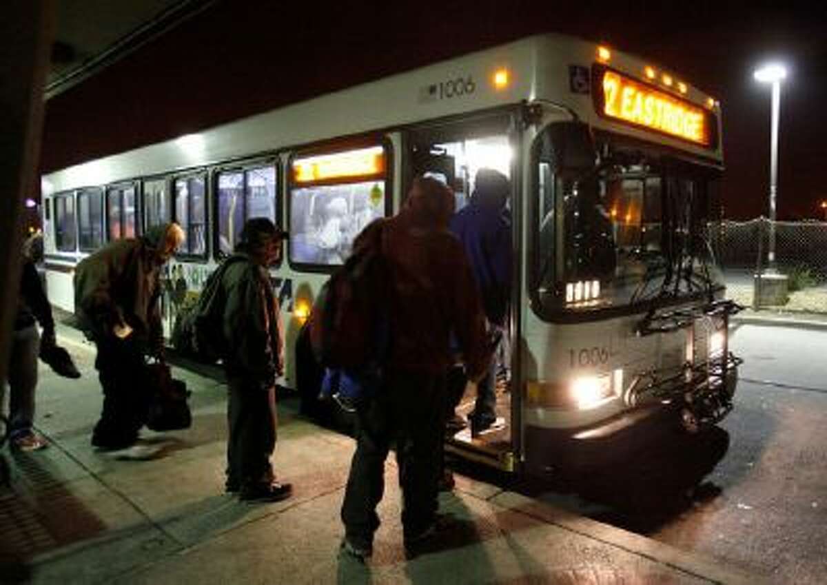 People wait to board the No. 22 VTA bus at about 1:20 a.m. morning, October 25.