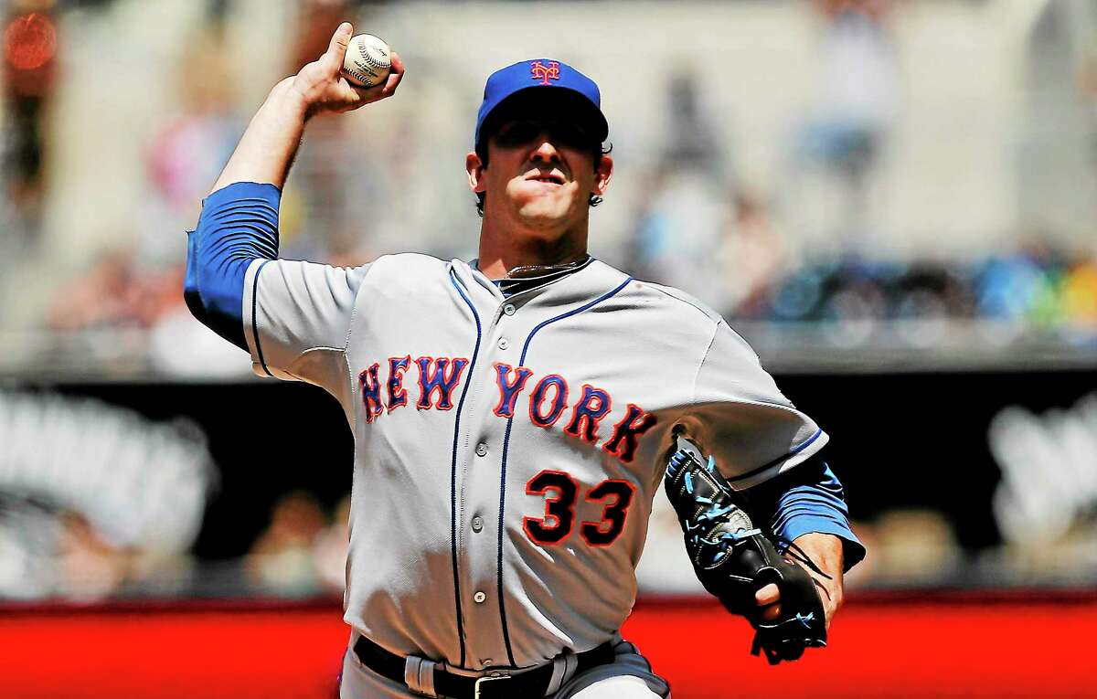 Mets pitcher Matt Harvey has a partially torn ligament in his throwing elbow and has been placed on the disabled list.