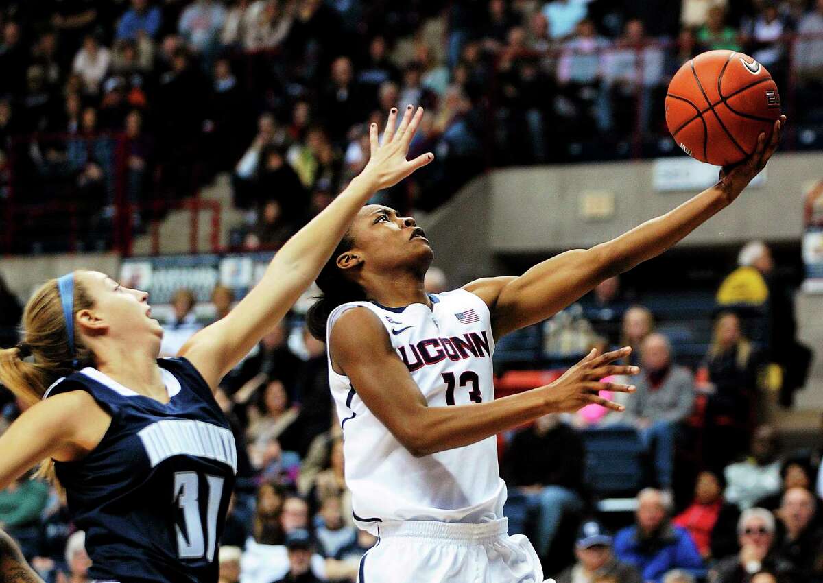 UConn’s Brianna Banks drives past Monmouth’s Jenny Horvatinovic during the Huskies’ Nov. 23 win in Storrs.