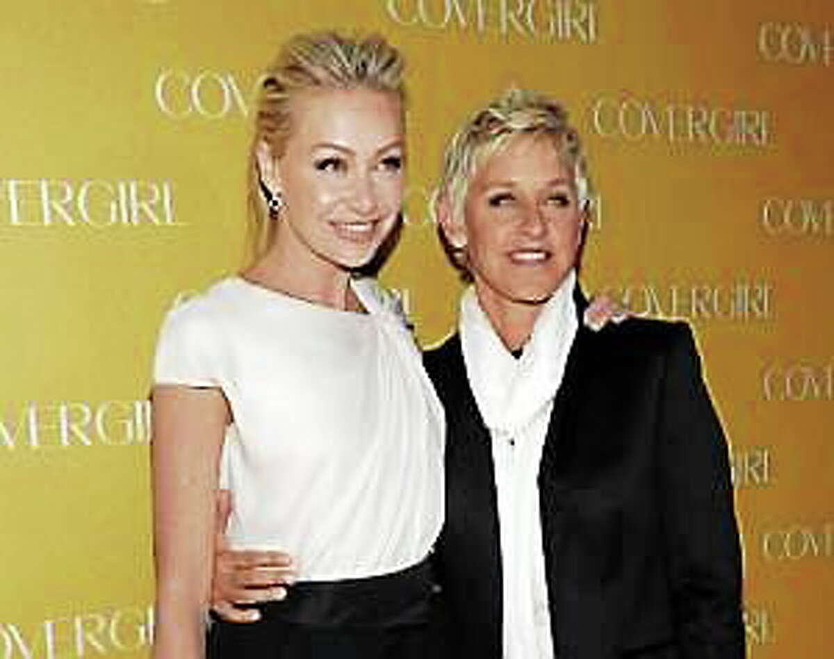 In this Jan. 5, 2011, file photo, television personality Ellen DeGeneres, right, and actress Portia de Rossi arrive at the COVERGIRL Cosmetics’ 50th Anniversary Party in Los Angeles.