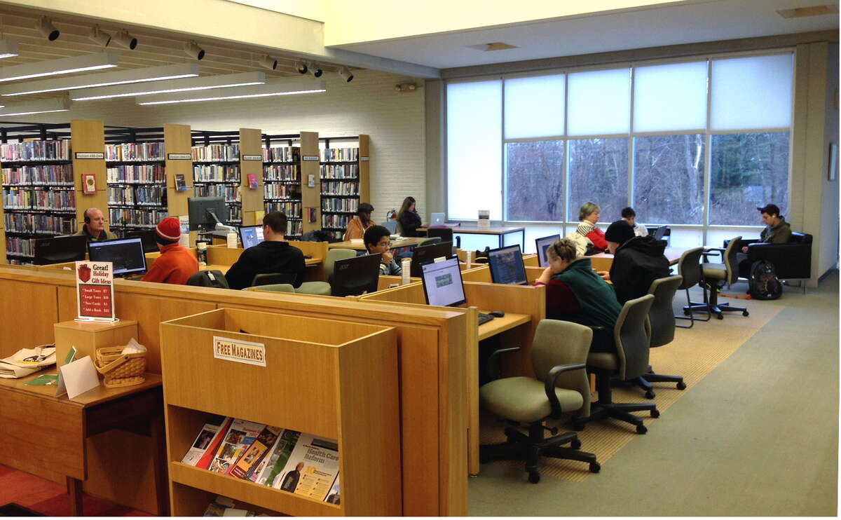 People studying in the Oliver Wolcott Library.