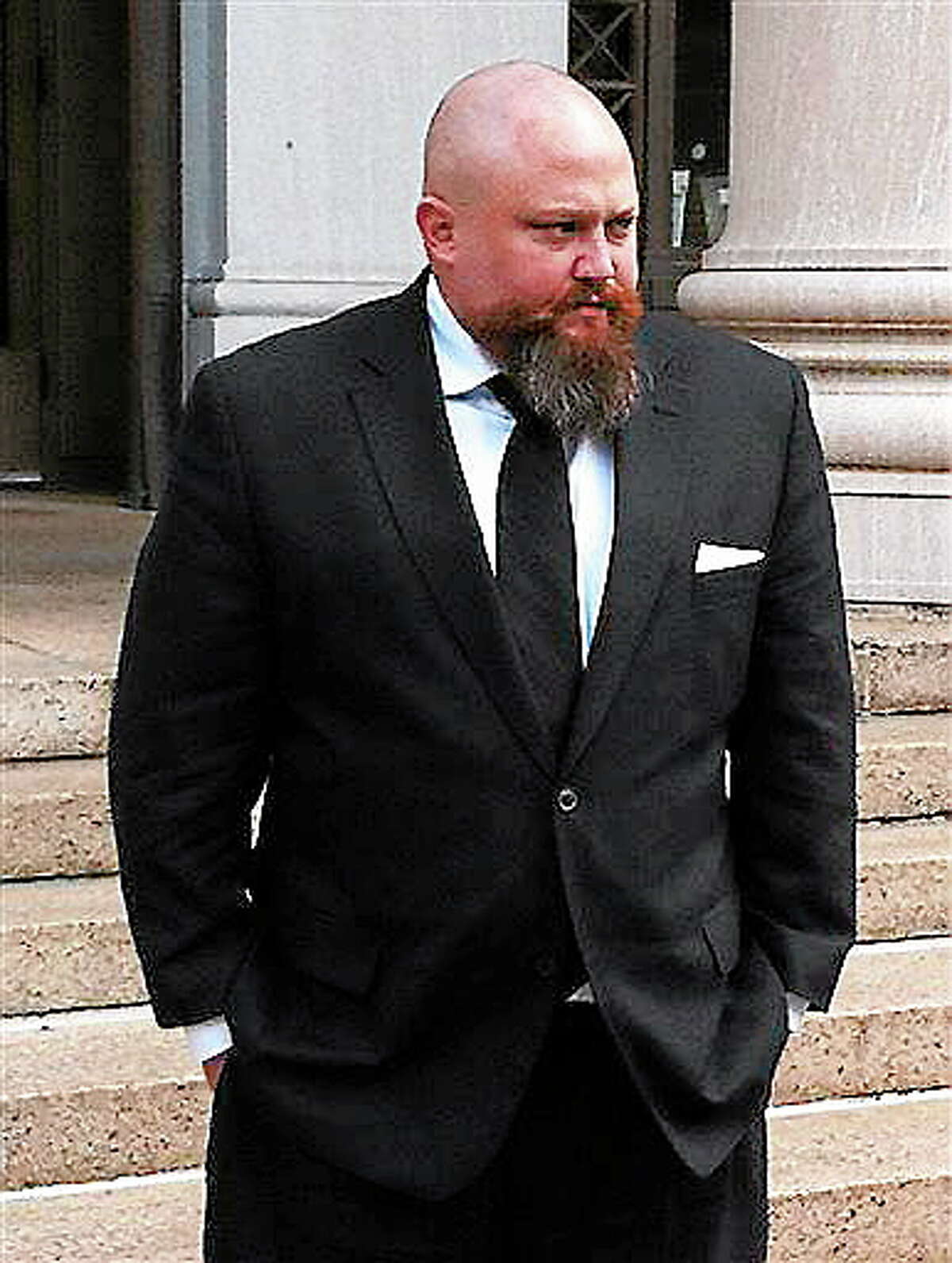 Robert Braddock Jr. walks outside federal court in New Haven, Conn., Monday May 13, 2013. Braddock, the finance director for ex-Connecticut House Speaker's failed congressional campaign last year, is on trial on conspiracy and campaign finance charges. (AP Photo/David Collins)