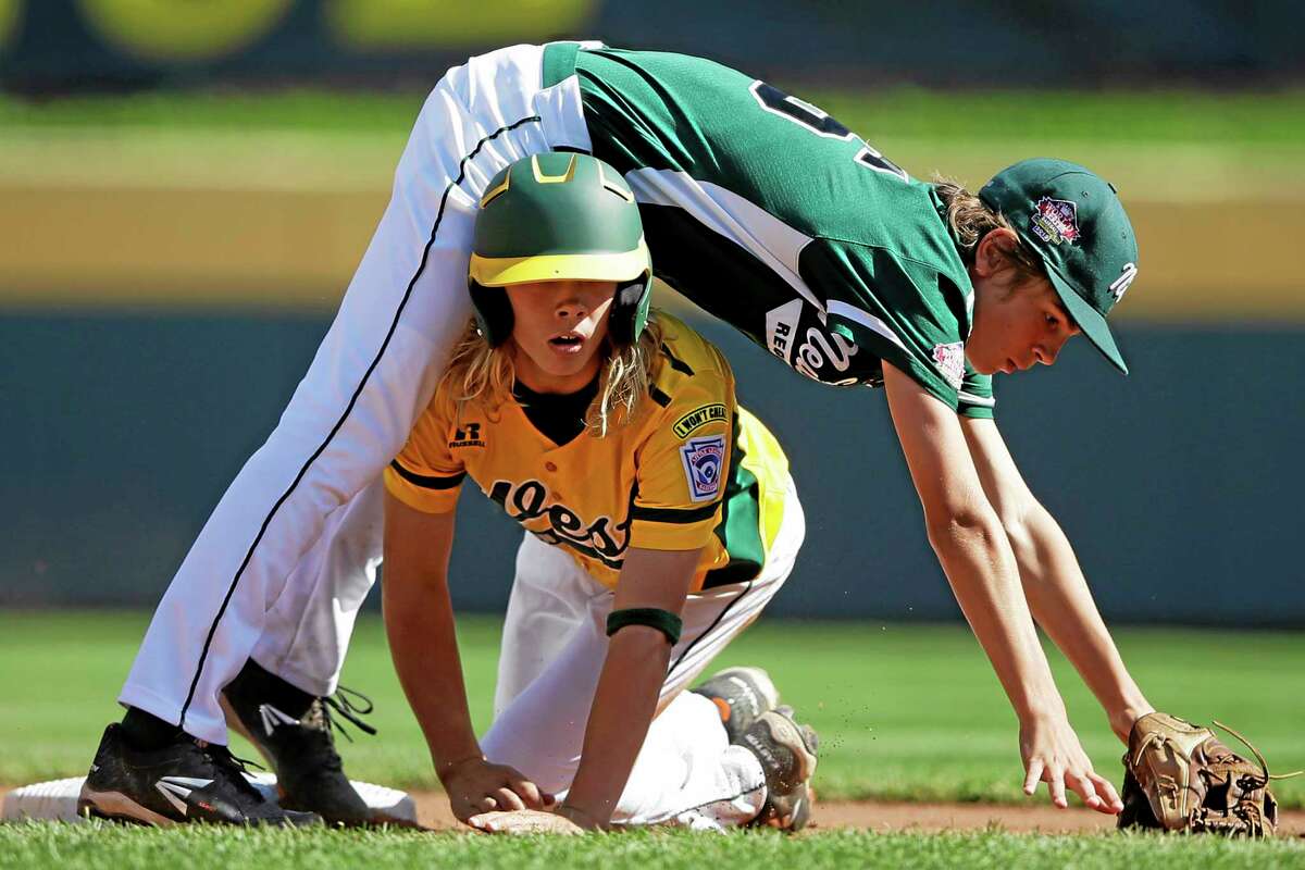 California’s Micah Pietila-Wiggs, bottom, breaks up a double play as Westport second baseman Max Popken falls over him during the first inning Saturday.