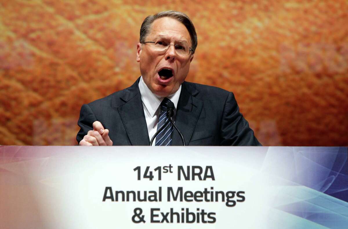 Wayne LaPierre Jr., Executive Vice President and Chief Executive Officer of the National Rifle Association speaks at its members annual meeting during its national convention in St. Louis on Saturday, April 14, 2012. LaPierre levied sharp criticism against the national media on Saturday, accusing it of sensationalizing the Trayvon Martin case and ignoring other crimes that happen across the country every day. He didn't mention the Martin case by name, but he accused the media of "sensational reporting from Florida." The 17-year-old Martin was unarmed when he was fatally shot Feb. 26 in Sanford, Fla., by neighborhood watch volunteer George Zimmerman, who claimed self-defense. (AP Photo/St. Louis Post-Dispatch, Christian Gooden)