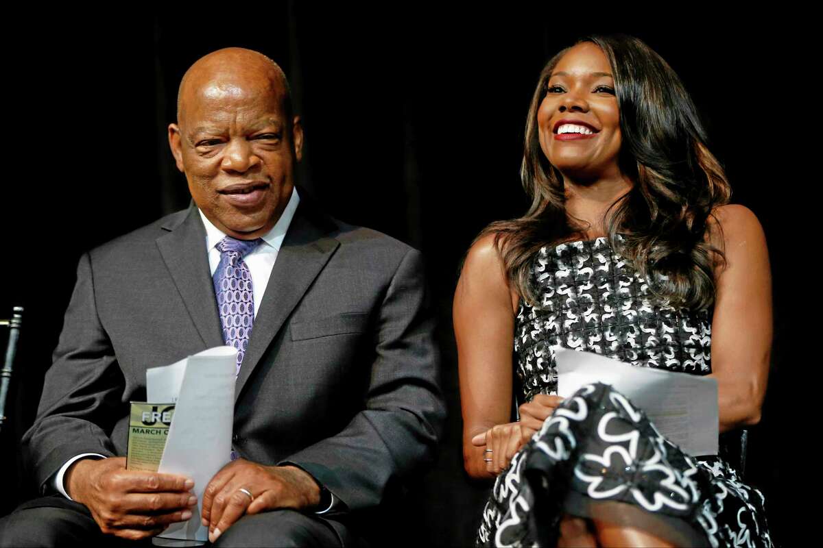 Actress Gabrielle Union and Rep. John Lewis, D-Ga., are seated on stage at the unveiling of a U.S. Postal Service stamp commemorating the 50th anniversary of the March on Washington, Friday, Aug. 23, 2013, at the Newseum in Washington.