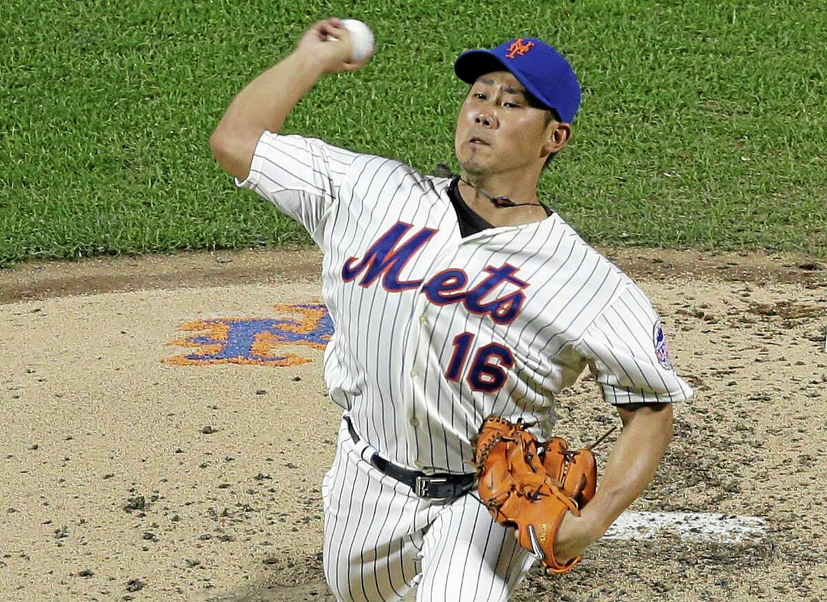 New York Mets' Daisuke Matsuzaka, of Japan, delivers a pitch during the fourth inning of a baseball game against the Detroit Tigers Friday, Aug. 23, 2013, in New York. (AP Photo/Frank Franklin II)