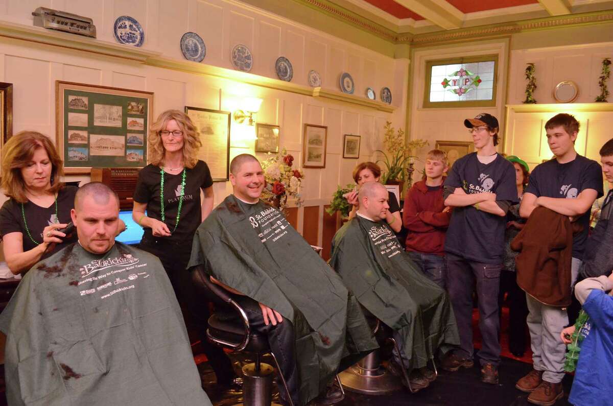 Members of the Torrington Fire Department and Police Department shaved their heads for childhood cancer research the 2013 St. Baldrick’s event.
