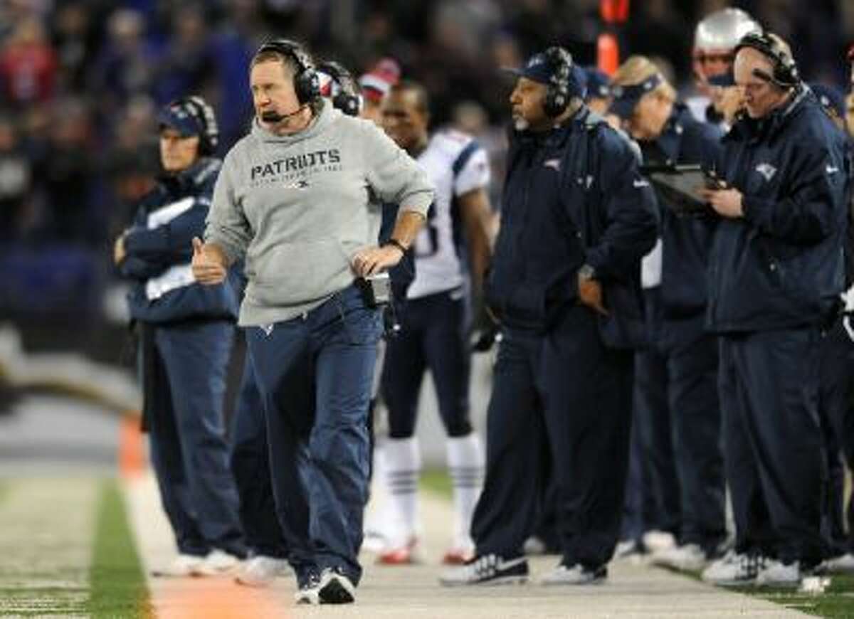 New England Patriots head coach Bill Belichick stands on the sideline in the second half of an NFL football game against the Baltimore Ravens, Sunday, Dec. 22, 2013, in Baltimore.