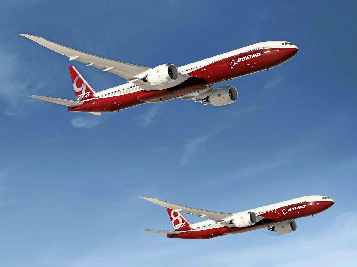 FILE - In this undated artist's concept provided by The Boeing Co., is the aerospace company's new family of 777X jetliners, the 777-9X, top, and 777-8X. Illinois has joined more than 20 states making a pitch to woo the aircraft manufacturer is to move production of its 777x airliners out of Washington state. Illinois may be uniquely unsuited to what Boeing needs because of its strong union presence, lack of any aircraft industry or ocean access. Boeing's list of wants isn't insignificant. It includes an airport location with a 9,000-foot runway (there are only a handful in Illinois) and adjacent rail access, as well as an ocean port. (AP Photo/The Boeing Co. File)
