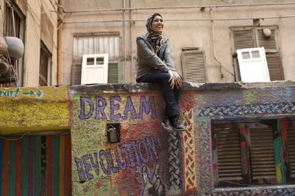 Egyptian rapper Myam Mahmoud poses for a portrait in downtown Cairo.