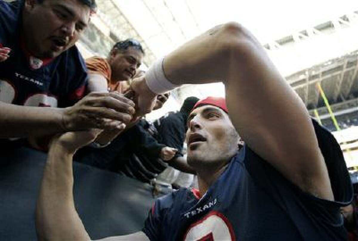 Houston Texans quarterback David Carr greets fans as he leaves the field after an NFL football game against the Cleveland Browns on Sunday, Dec. 31, 2006, in Houston. The Texans won 14-6.