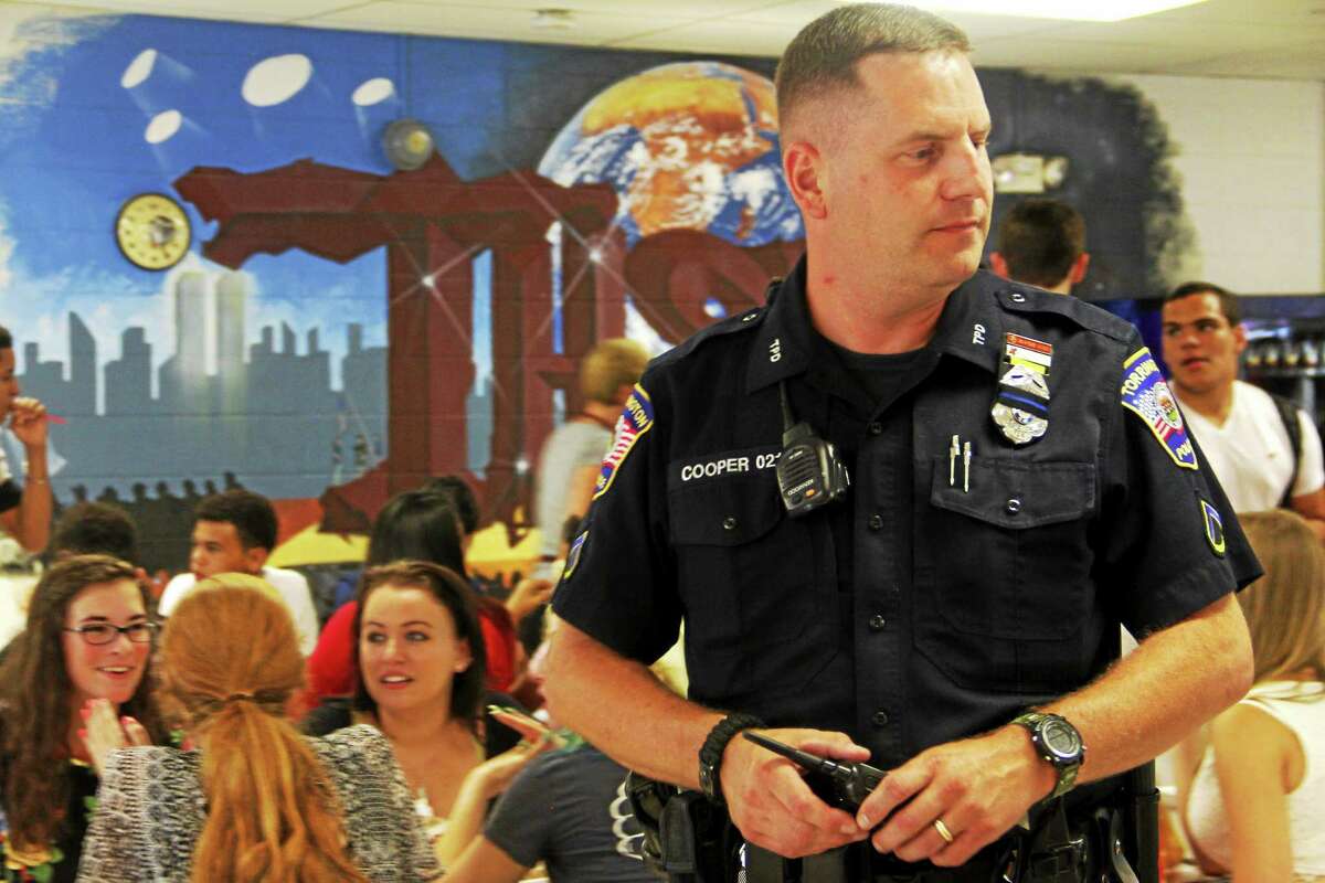 Torrington High School’s new School Resource Officer David Cooper, of the Torrington Police Department, inside the school’s cafeteria Wednesday in Torrington. Wednesday was the first school day of the year for the district and Cooper’s first day on the job.