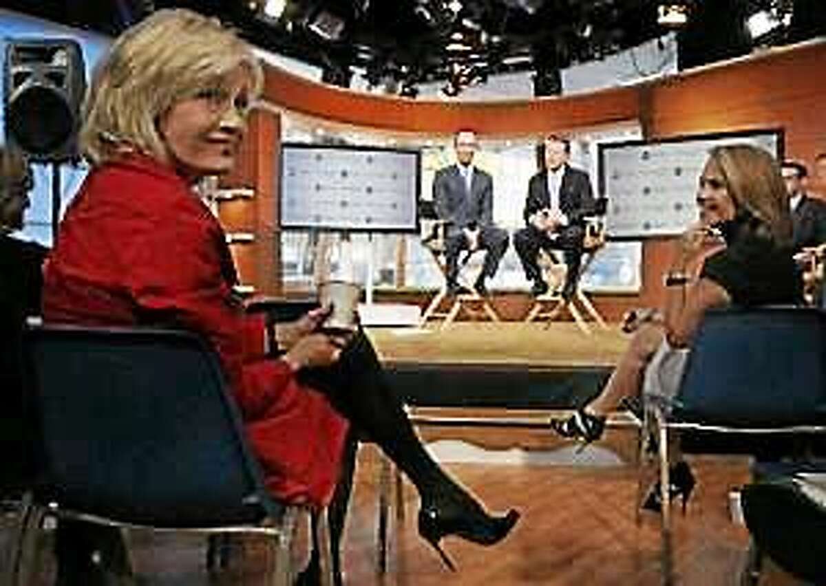 ABC News’ Diane Sawyer, left, and Katie Couric, flank ABC News President Ben Sherwood, background left, and Ross Levinsohn, background right, Yahoo’s Executive Vice President of Americas, during a news conference in New York, Monday, Oct. 3, 2011.