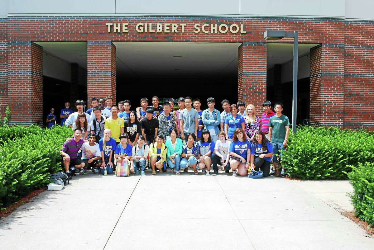 Past international students from China gather outside of the Gilbert School after the closing ceremony