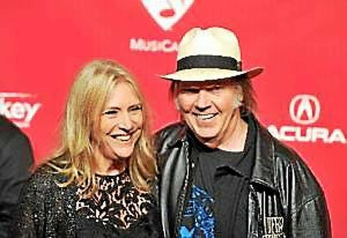 Neil Young and Pegi Young arrive at the 2012 MusiCares Person of the Year Tribute to Paul McCartney, held at the Los Angeles Convention Center on February 10, 2012 in Los Angeles.