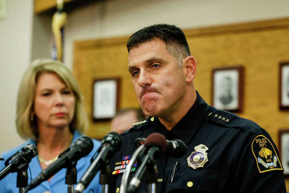 Omaha Police Chief Todd Schmaderer pauses during a news conference at police headquarters in Omaha, Neb., Wednesday, Aug. 27, 2014, with Omaha Mayor Jean Stothert, left. Bryce Dion, a sound technician with the ìCopsî television show who was embedded with Omaha police, was killed on Tuesday during an armed robbery at a Wendy's fast-food restaurant. The armed robber was shot and died as well. (AP Photo/Nati Harnik)