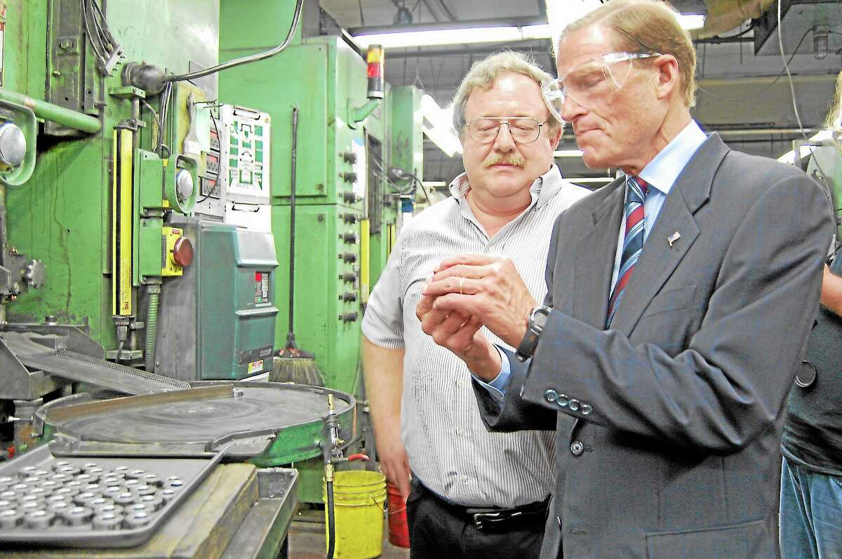 Sen. Richard Blumenthal tours Sterling Sintered Technologies with Quality Engineer John Bartram in Winsted on Thursday, Aug. 22.