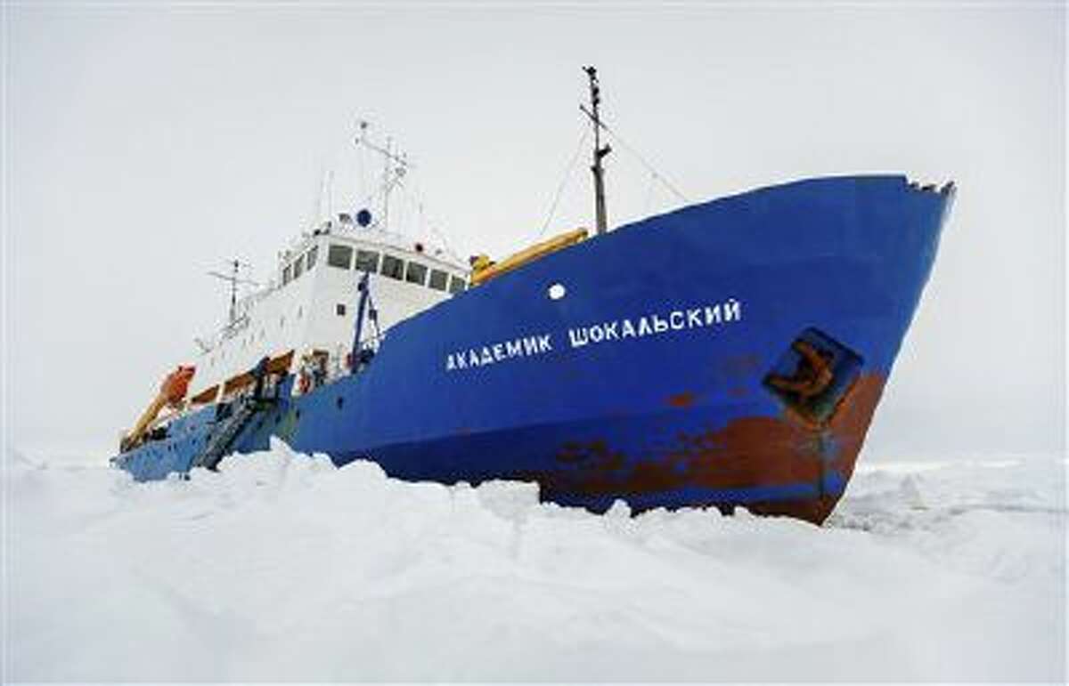 The Russian ship MV Akademik Shokalskiy is trapped in thick Antarctic ice 1,500 nautical miles south of Hobart, Australia, Friday, Dec. 27, 2013.