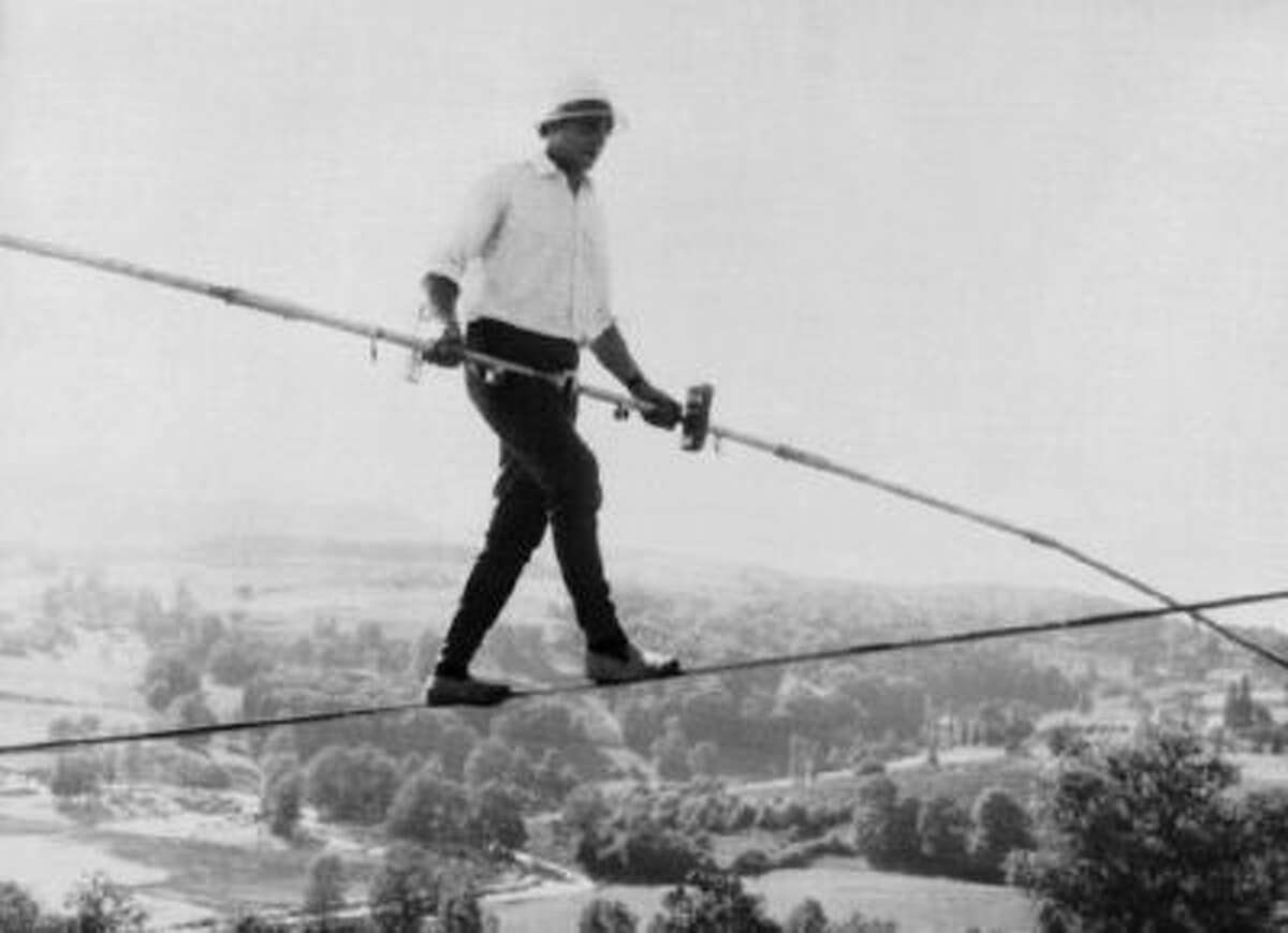 French tightrope walker Henri Rechatin walks over the Saint-Remy sur Durolle countryside in central France, in this July 16, 1967 file photo, as he breaks the specialty's world record of the time.