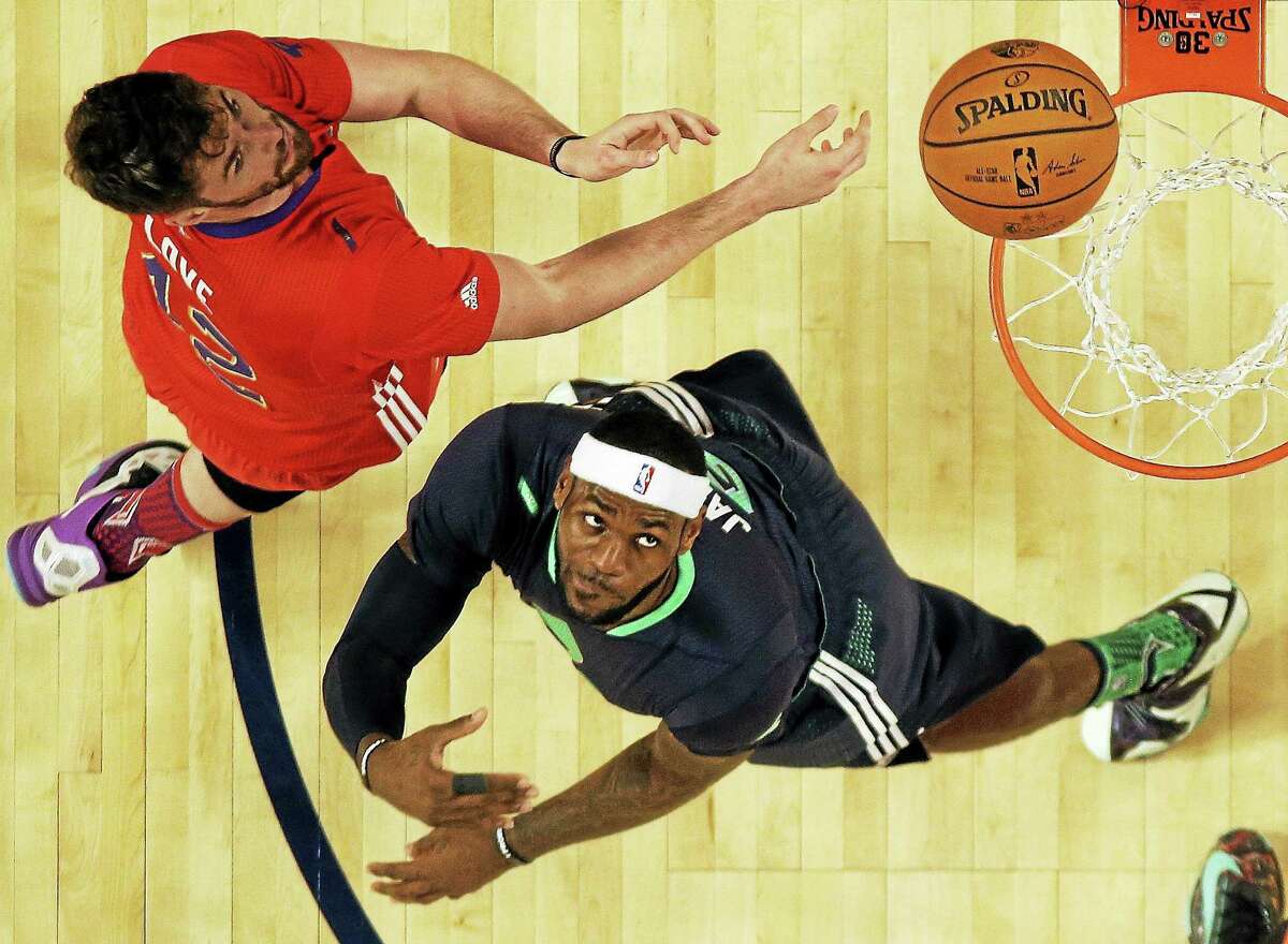 In this Feb. 16 file photo, the West’s Kevin Love, left, defends against the East’s LeBron James during the NBA All Star Game in New Orleans.