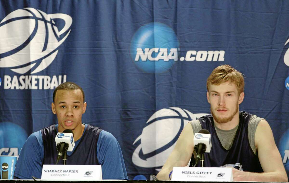 UConn’s Shabazz Napier, left, and Niels Giffey respond to questions during a news conference in Buffalo, N.Y., on Friday. UConn plays Villanova in an NCAA tournament third-round game Saturday night.