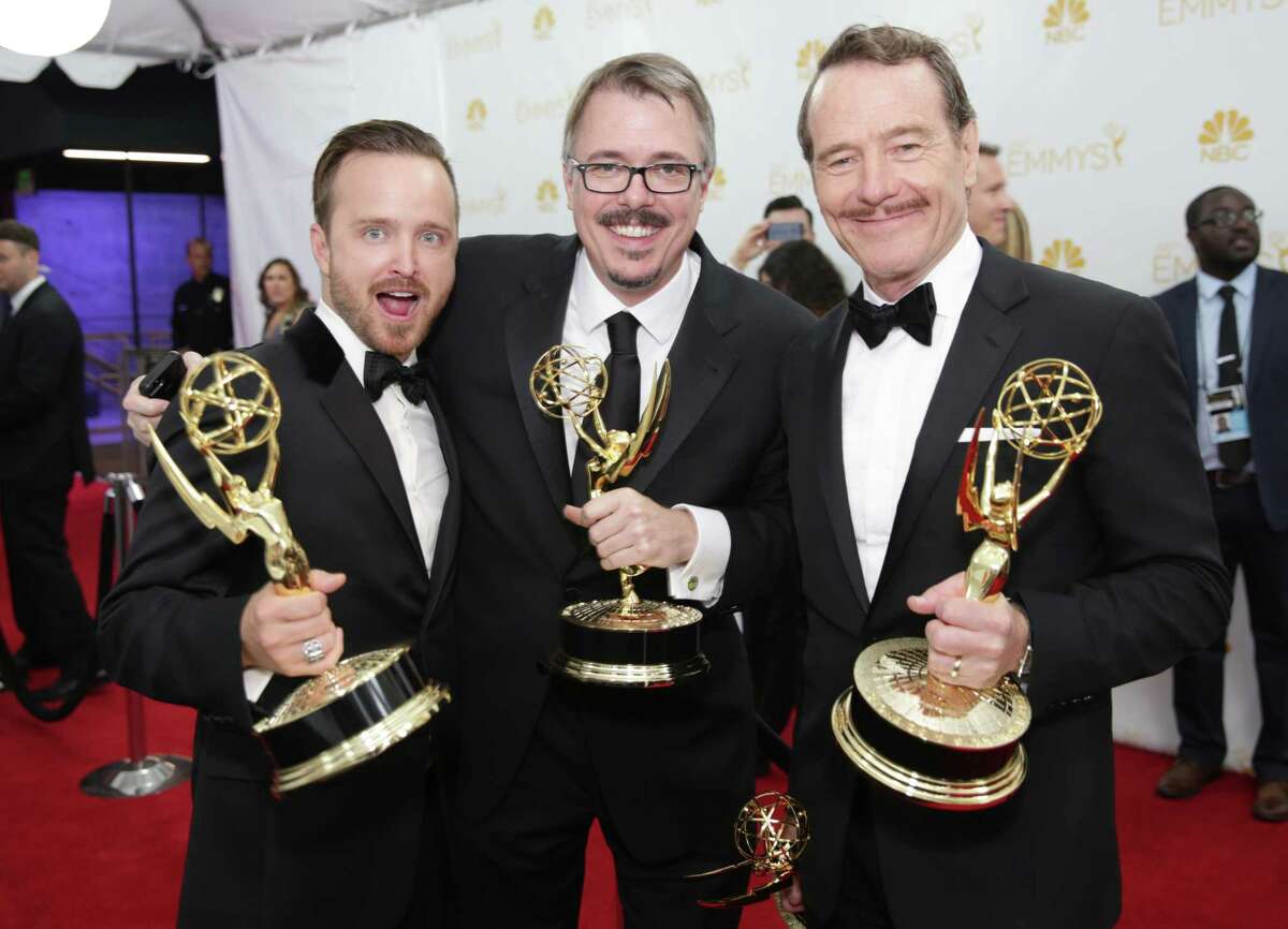 Aaron Paul, left, Vince Gilligan and Bryan Cranston pose at the 66th Primetime Emmy Awards at the Nokia Theatre L.A. Live on Monday, Aug. 25, 2014, in Los Angeles.