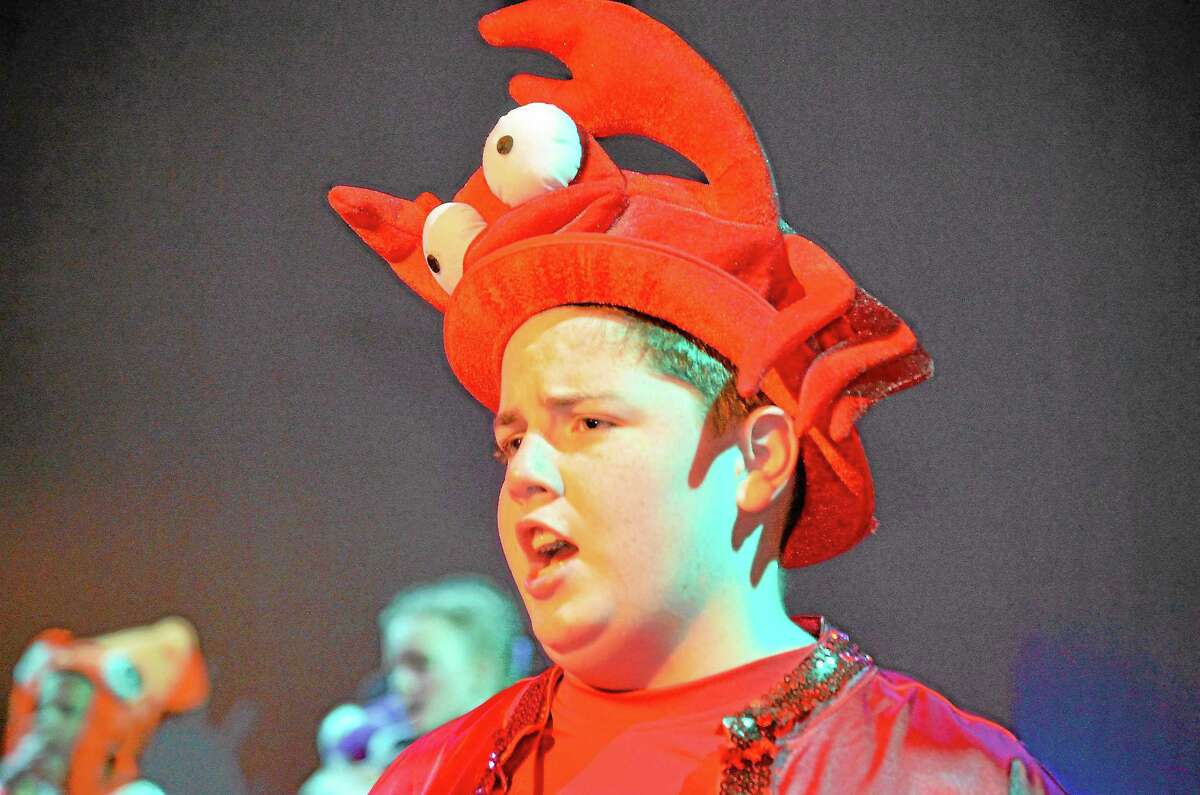 Sebastian the crab, played by Wolcott resident Nolan Cummings, urges Prince Eric to 'Kiss the Girl.'