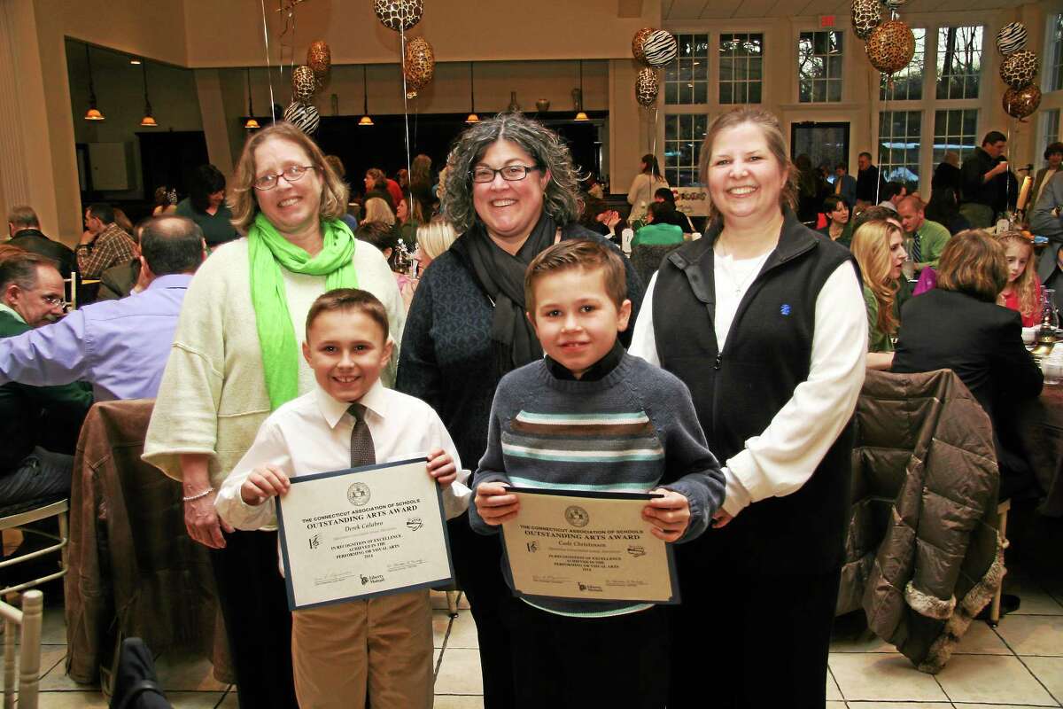 The Connecticut Association of Schools celebrated their 15th annual Celebration of the Arts at the Aqua Turf in Southington, on March 17. Harwinton Consolidated Elementary School fourth graders, Derek Calabro and Cade Christensen, were recognized for their citizenship, cooperative skills, and artistic ability in both the performing and visual arts. Pictured: back row: HCS Art teacher, Liz Spring, HCS Principal, Megan Mazzei, HCS Music teacher, Dawn Conroy; front row: Derek Calabro (art), Cade Christensen (music).