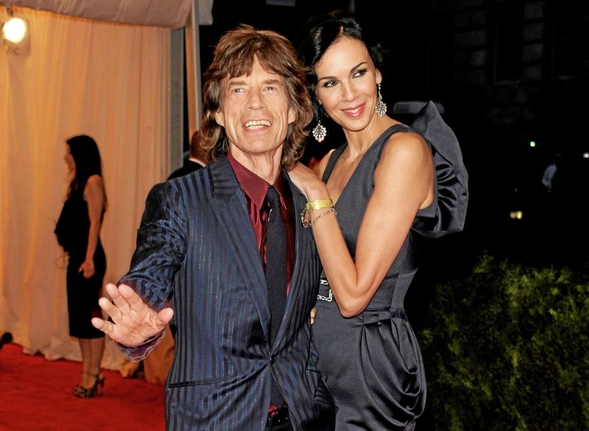 FILE - This May 7, 2012 file photo shows singer Mick Jagger, left, and L'Wren Scott at the Metropolitan Museum of Art Costume Institute gala benefit, celebrating Elsa Schiaparelli and Miuccia Prada, in New York. Scott, a fashion designer, was found dead Monday, March 17, 2014, in Manhattan of a possible suicide. (AP Photo/Evan Agostini, File)
