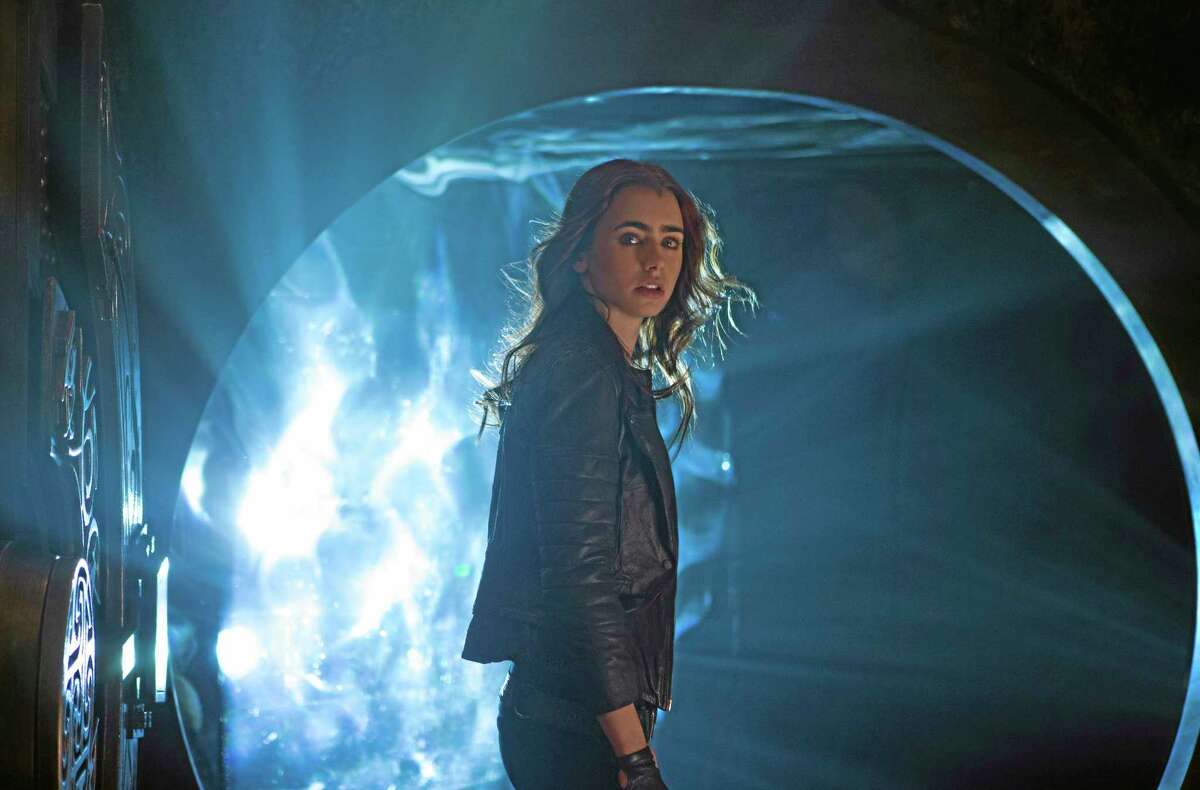 This film publicity image released by Screen Gems shows Lilly Collins as Clary in a scene from "The Mortal Instruments: City of Bones." (AP Photo/Sony Pictures Screen Gems, Rafy)