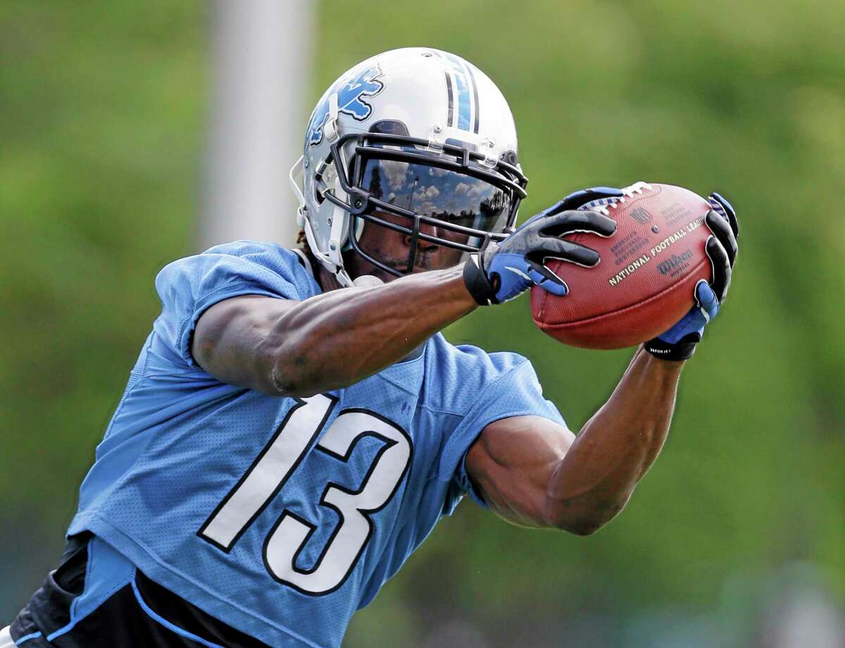FILE - In this July 26, 2013 file photo, Detroit Lions receiver Nate Burleson runs through drills during an NFL football training camp in Allen Park, Mich. Burleson and Ryan Broyles appear to be healthy after having season-ending injuries, and the Detroit Lions need them to be because receiver Calvin Johnson needs some help. (AP Photo/Carlos Osorio, File)