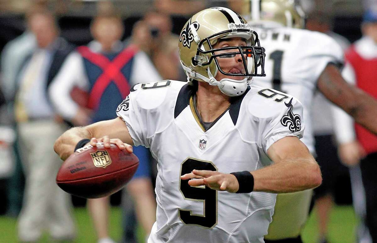New Orleans Saints quarterback Drew Brees (9) scrambles during the first half of an NFL preseason football game against the Kansas City Chiefs at the Mercedes-Benz Superdome in New Orleans, Friday, Aug. 9, 2013. (AP Photo/Jonathan Bachman)