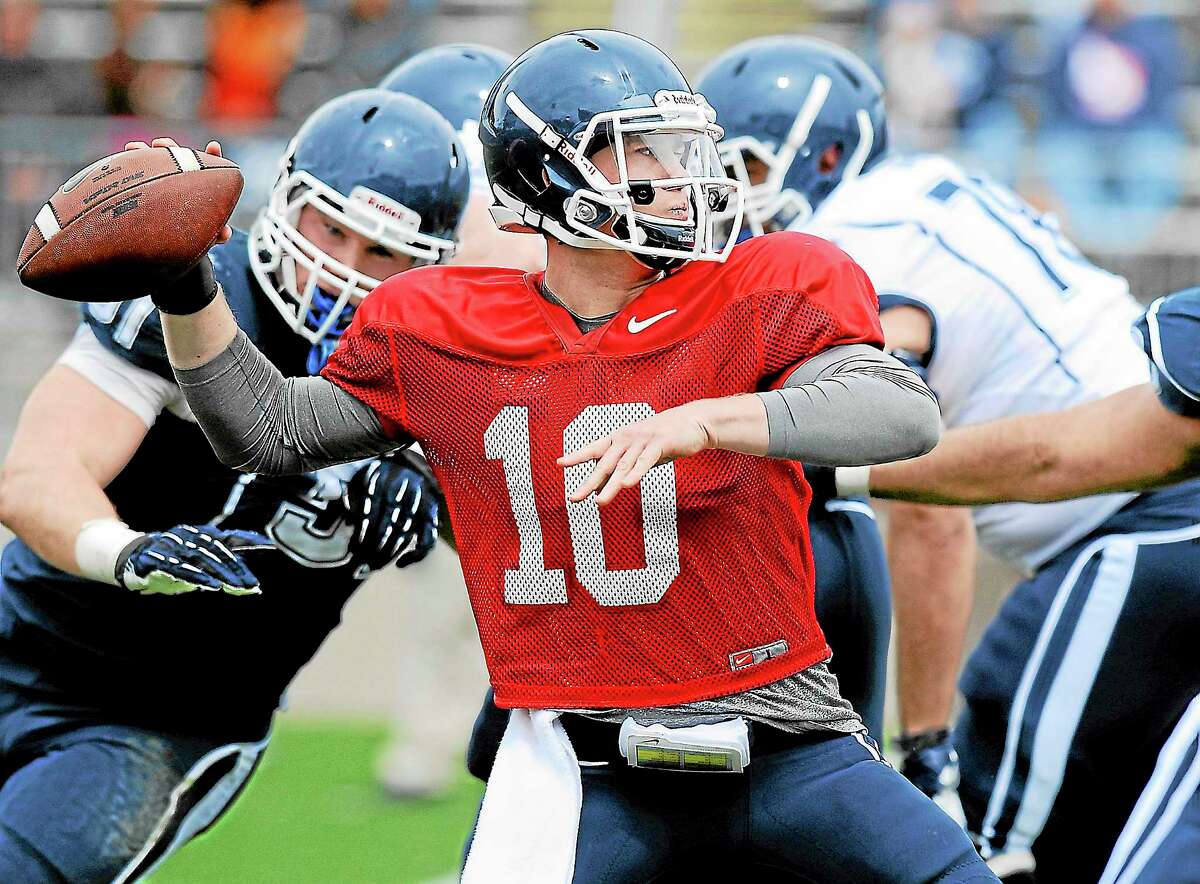 Connecticut quarterback Chandler Whitmer throws during UConn's Blue-White spring NCAA college football game at Rentschler Field in East Hartford, Conn., Saturday, April 20, 2013. (AP Photo/Jessica Hill)
