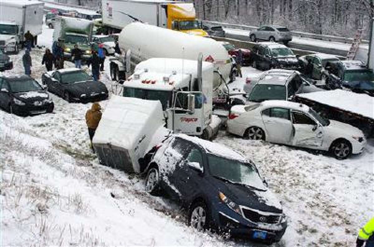 Vehicles are piled up on the Pennsylvania Turnpike, a mile outside Reading, Pa., on Thursday, Dec. 26, 2013.