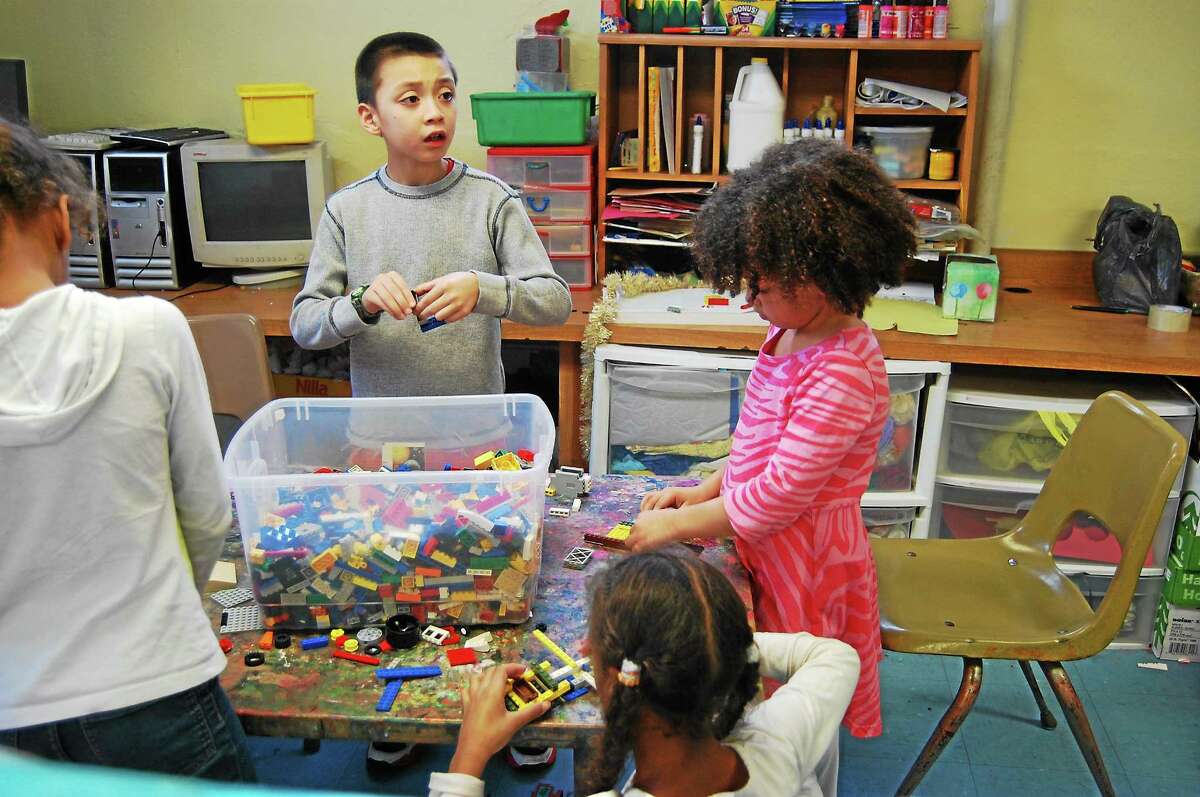 Children build their own creations Thursday as part of the recently-added Lego Club at the Northwest Connecticut YMCA in Torrington.