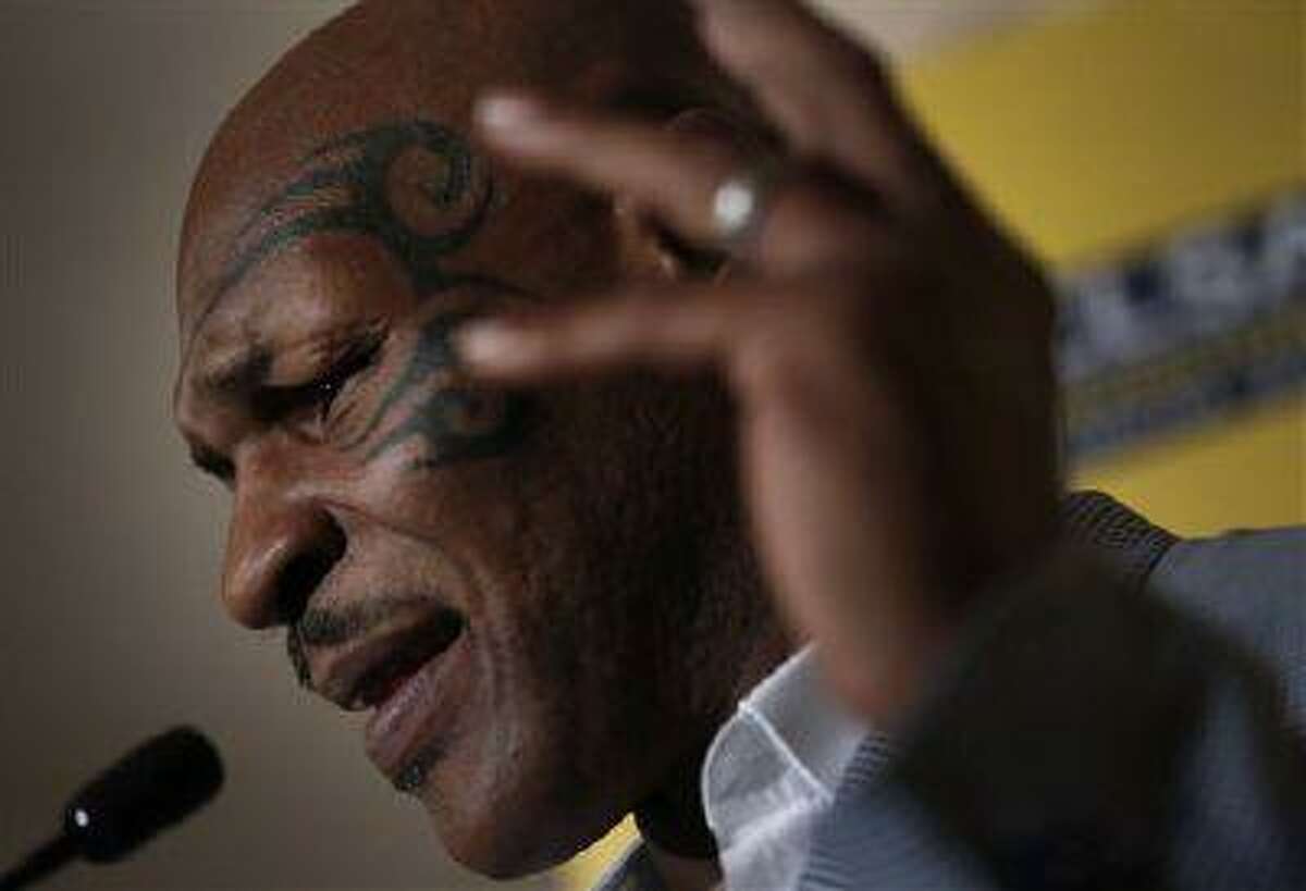 Former heavyweight boxing champion Mike Tyson speaks a press conference at the 19th Credit Lyonnais Securities Asia investors Forum at a hotel in Hong Kong Wednesday, Sept. 12, 2012.